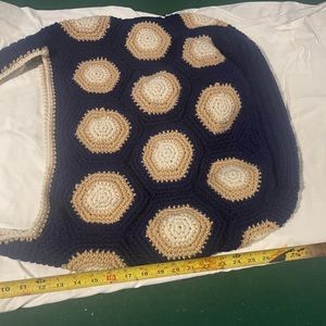 Crochet shoulder bag/tote. Will hold a lot. Well made and densely crocheted.